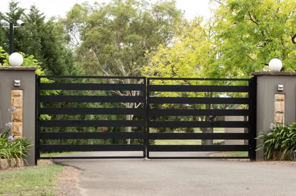Modern black horizontal slat driveway gate